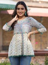 Women Ivory Cotton Cambric Tribal Printed Peplum Tunic.