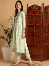 Women Green Silk Blend Solid Embroidered Flared Kurta with Trouser