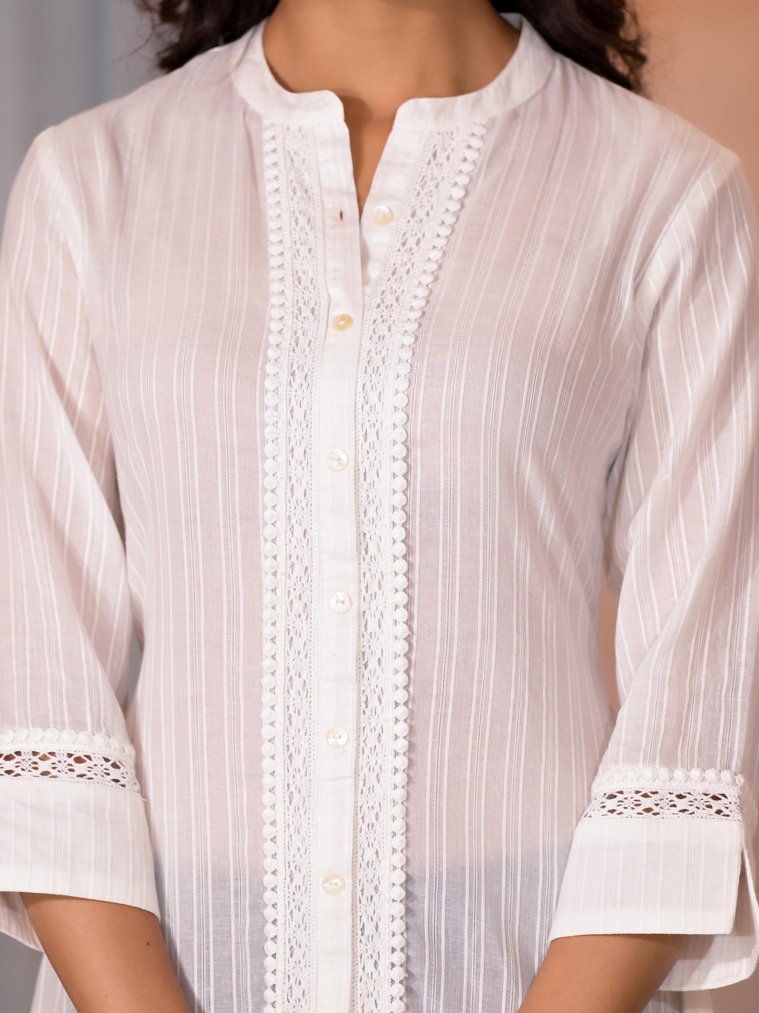 Off White Thread Embroidered Cotton Asymmetrical Kurta With Button Clo
