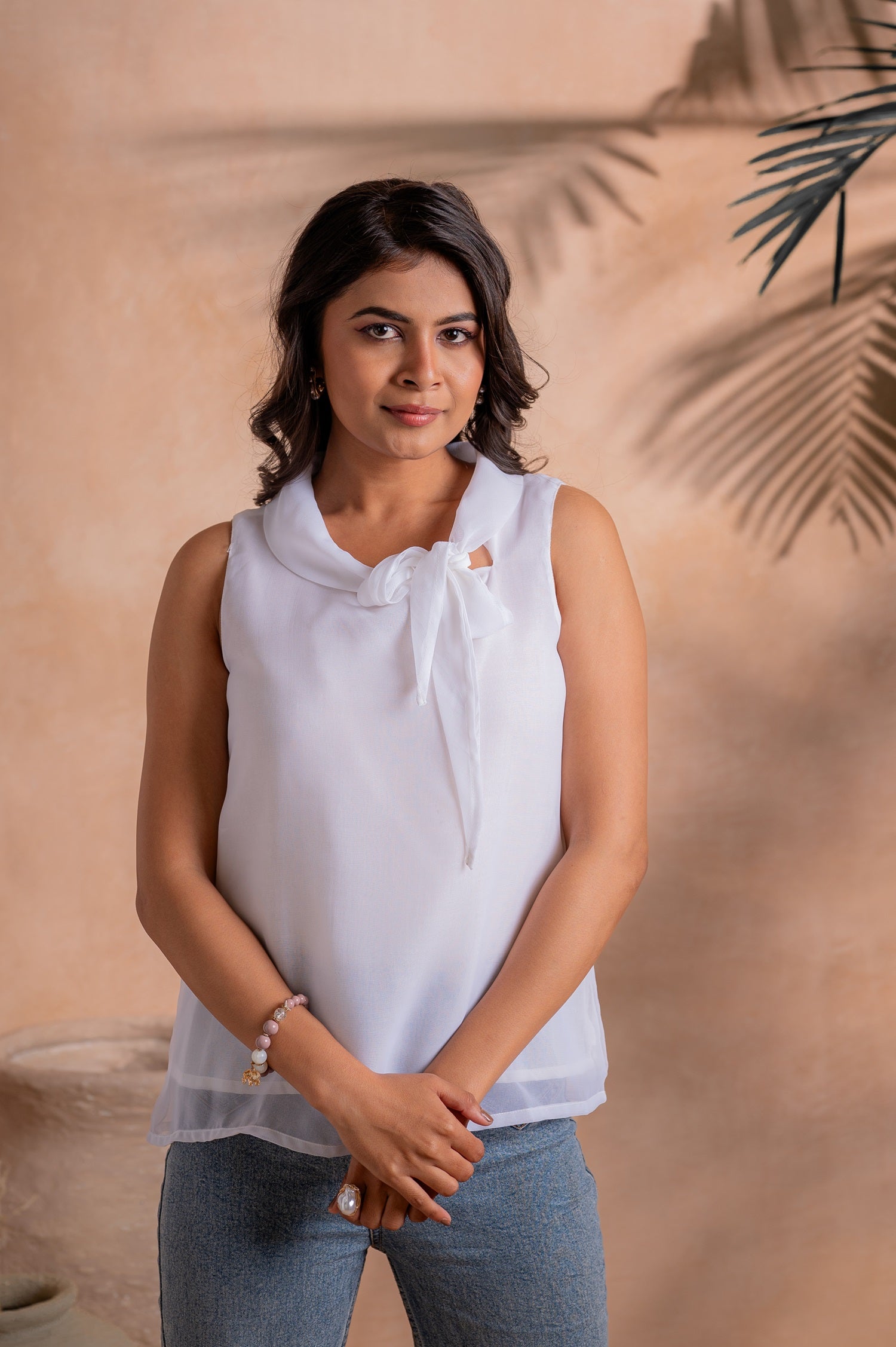 Elegant White Sleeveless Bow-Neck Layered Hem Top | DesiQlo