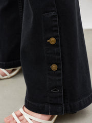 Women Jet Black Button-at-Hem Boot Cut Jeans