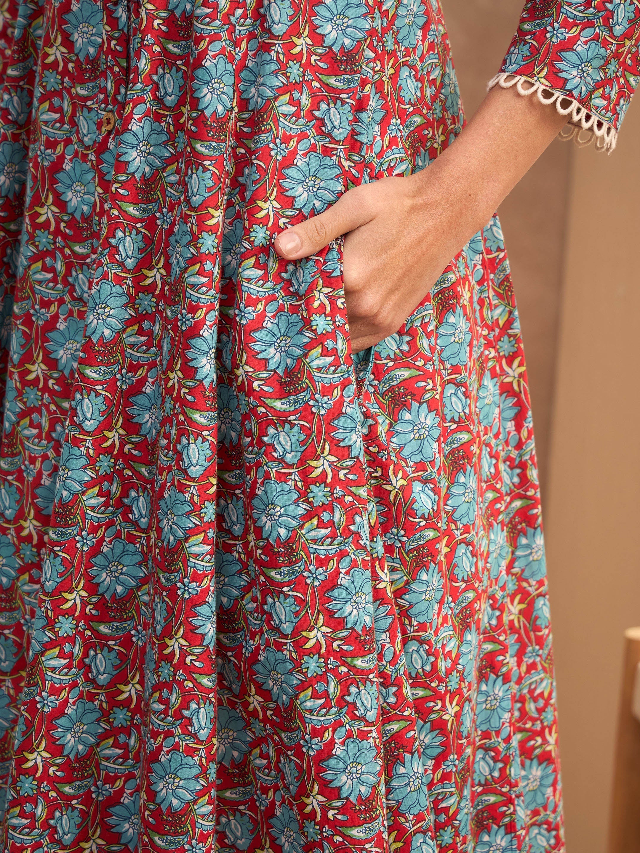 Women Red Floral Buttonned Pocket Kurta-SHKUR35012